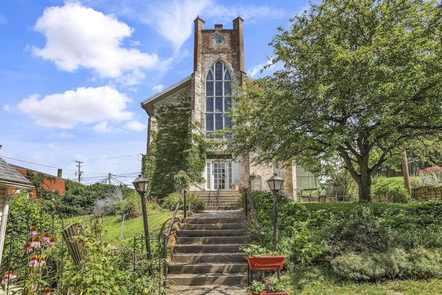 131 E Chestnut St, Lancaster, OH 43130 - view of front of home with stairway and a chimney