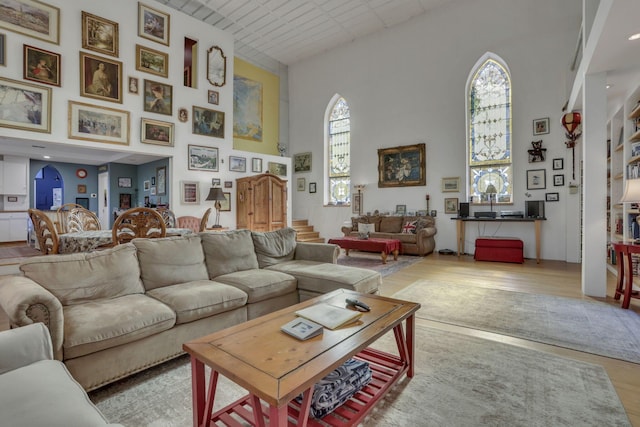131 E Chestnut St, Lancaster, OH 43130 - living area featuring a high ceiling, wood finished floors, and healthy amount of natural light