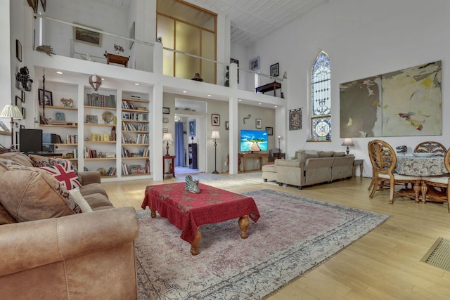 131 E Chestnut St, Lancaster, OH 43130 - living room featuring wood finished floors and a high ceiling
