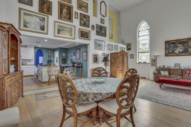 131 E Chestnut St, Lancaster, OH 43130 - dining room featuring light wood-type flooring and a towering ceiling
