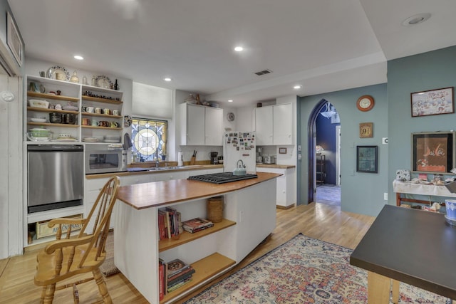 131 E Chestnut St, Lancaster, OH 43130 - kitchen with open shelves, arched walkways, white cabinetry, recessed lighting, and stainless steel appliances