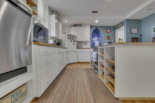 131 E Chestnut St, Lancaster, OH 43130 - kitchen with open shelves, stainless steel appliances, white cabinets, recessed lighting, and light wood-style flooring