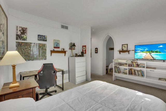 131 E Chestnut St, Lancaster, OH 43130 - carpeted bedroom featuring arched walkways and a desk