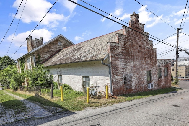 131 E Chestnut St, Lancaster, OH 43130 - view of side of home with a chimney and brick siding