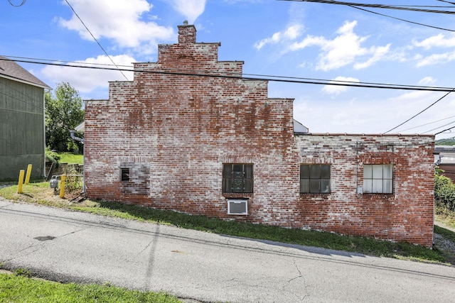 131 E Chestnut St, Lancaster, OH 43130 - view of property exterior featuring brick siding and a chimney
