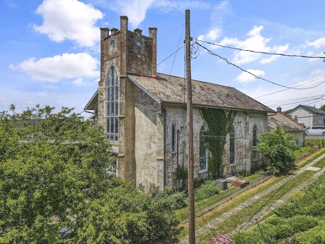 131 E Chestnut St, Lancaster, OH 43130 - view of home's exterior featuring brick siding and a chimney