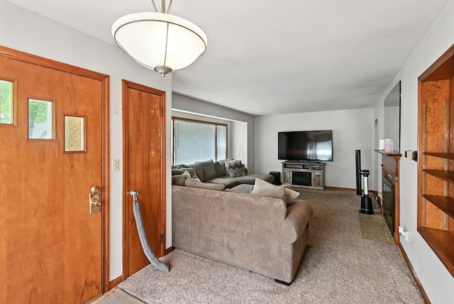 305 N Boston St, Galion, OH 44833 - living room featuring carpet and a fireplace with flush hearth