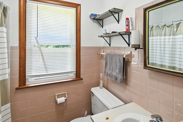 305 N Boston St, Galion, OH 44833 - bathroom with tile walls, vanity, curtained shower, and a wainscoted wall