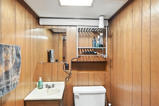 305 N Boston St, Galion, OH 44833 - bathroom featuring vanity and wood walls