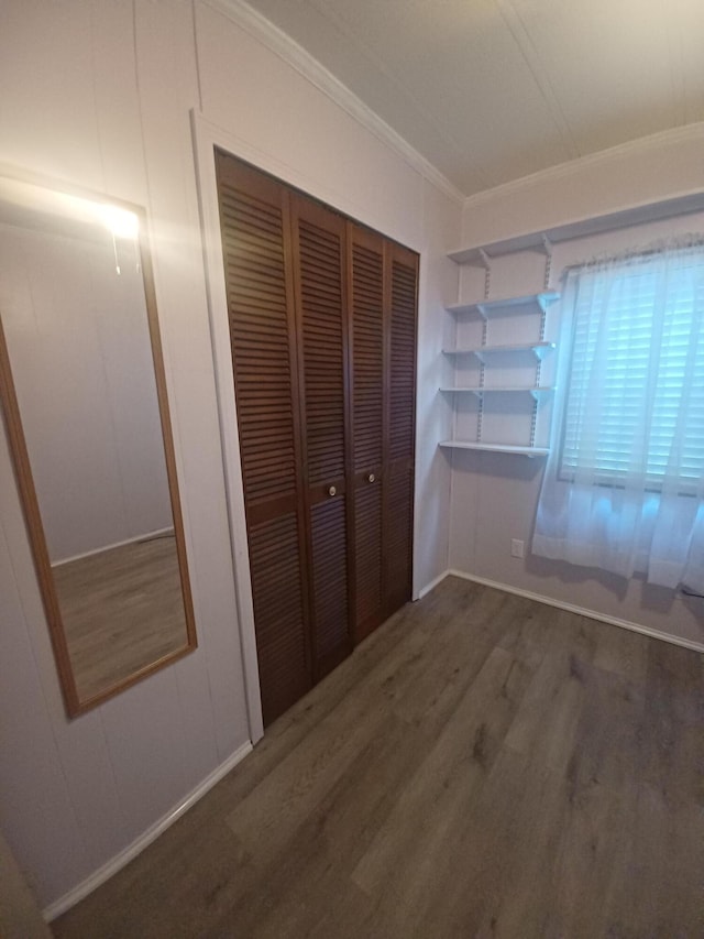 3200 Smeltzer Rd Unit 70, Marion, OH 43302 - unfurnished bedroom with wood finished floors, ornamental molding, and a closet