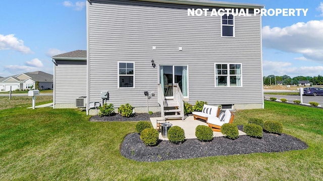 1769 Jacko Ln, Circleville, OH 43113 - back of house with a lawn, entry steps, and a patio area