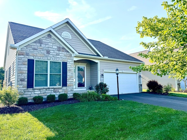 2989 Tree Bend Cir, Grove City, OH 43123 - ranch-style house with stone siding, a garage, a front yard, driveway, and a shingled roof