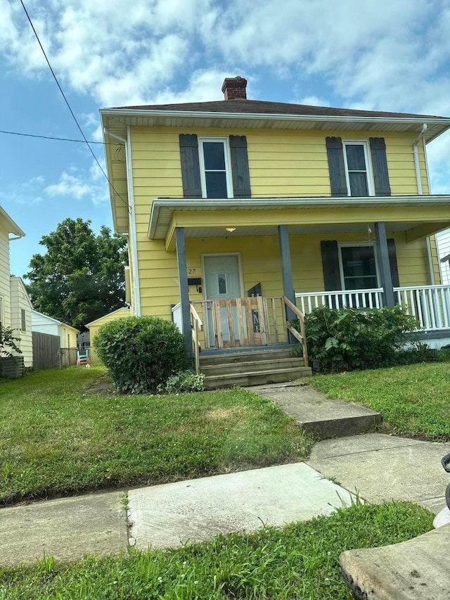 27 E Channel St, Newark, OH 43055 - view of front of house with covered porch, a chimney, and a front yard