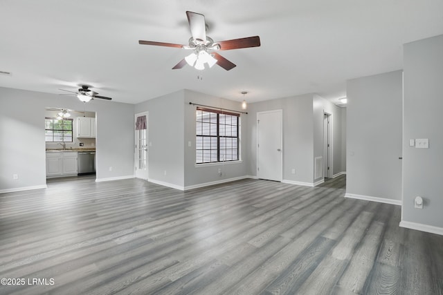 947 Oyster Cove Rd, Beaufort, SC 29902 - unfurnished living room with a ceiling fan, a sink, and dark wood finished floors