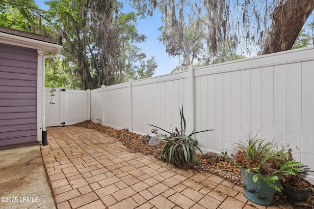 view of patio with a fenced backyard and a gate