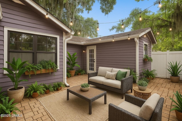 view of patio / terrace with an outdoor hangout area and fence