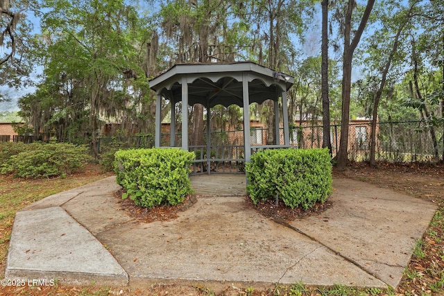 view of property's community featuring a gazebo and fence