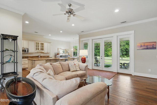 27 Normandy Ave, Bluffton, SC 29910 - living room with crown molding, recessed lighting, a ceiling fan, dark wood-type flooring, and french doors