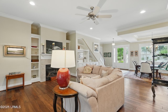 27 Normandy Ave, Bluffton, SC 29910 - living area with dark wood-style flooring, stairway, baseboards, ornamental molding, and recessed lighting