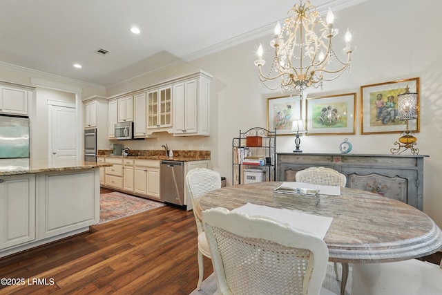 27 Normandy Ave, Bluffton, SC 29910 - dining room with ornamental molding, dark wood-style flooring, a chandelier, and recessed lighting