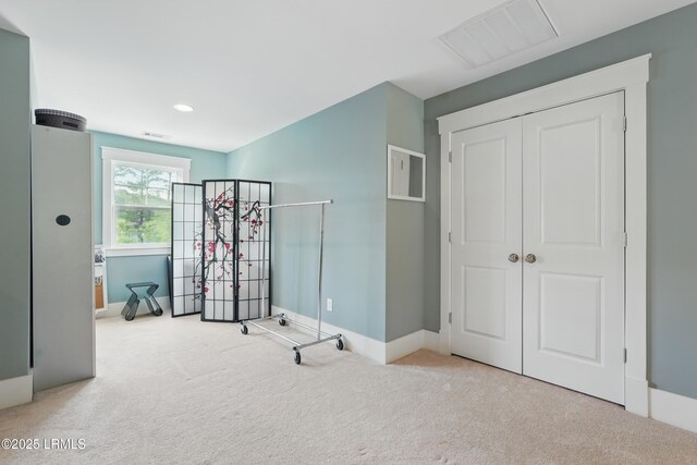 27 Normandy Ave, Bluffton, SC 29910 - bedroom with carpet, baseboards, a closet, and recessed lighting