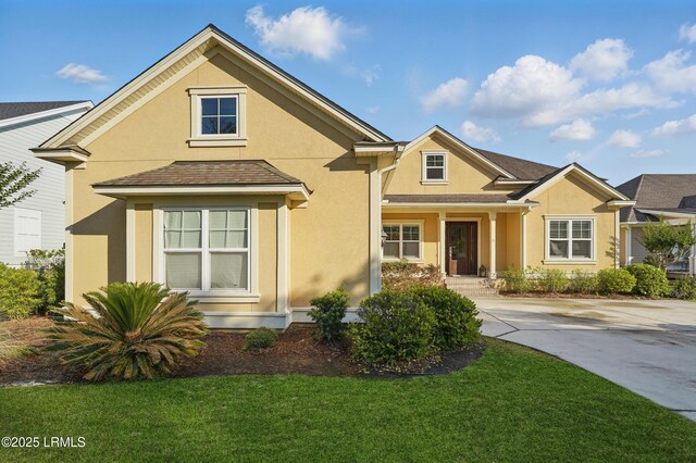 27 Normandy Ave, Bluffton, SC 29910 - traditional-style house with stucco siding and a front lawn