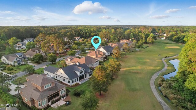27 Normandy Ave, Bluffton, SC 29910 - aerial overview of property's location with nearby suburban area, a golf club, and a heavily wooded area