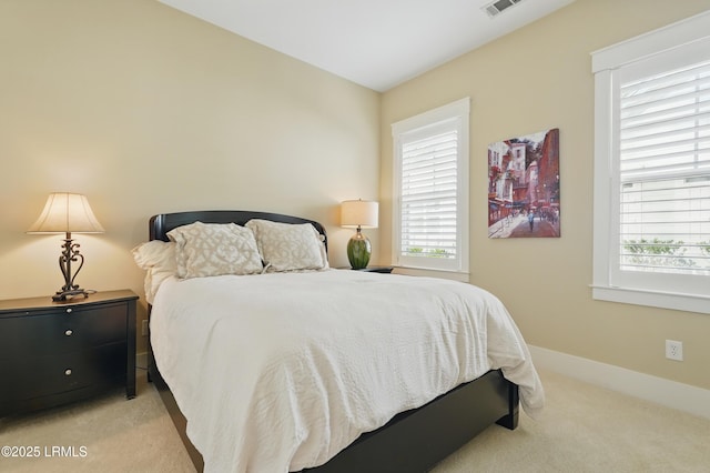 27 Normandy Ave, Bluffton, SC 29910 - bedroom featuring light carpet, multiple windows, and baseboards
