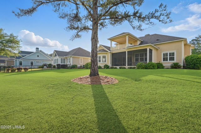 27 Normandy Ave, Bluffton, SC 29910 - rear view of house featuring a sunroom and stucco siding