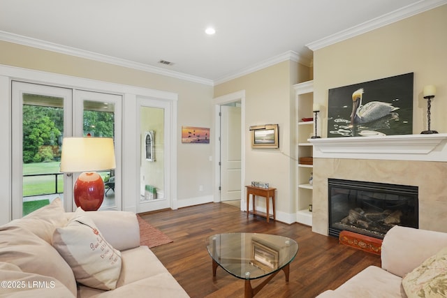 27 Normandy Ave, Bluffton, SC 29910 - living area featuring ornamental molding, wood finished floors, baseboards, a premium fireplace, and built in features