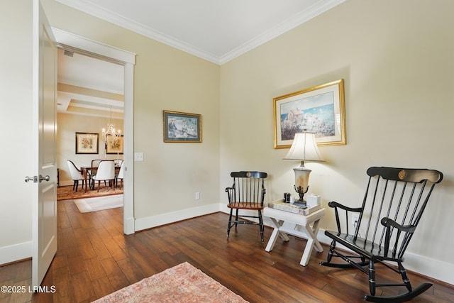 27 Normandy Ave, Bluffton, SC 29910 - living area featuring crown molding, dark wood-style floors, baseboards, and a chandelier