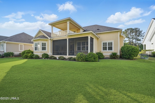 27 Normandy Ave, Bluffton, SC 29910 - rear view of house with a balcony, a lawn, a sunroom, and roof with shingles