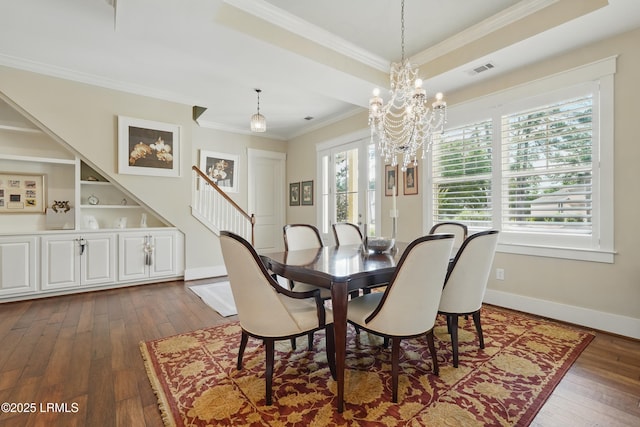 27 Normandy Ave, Bluffton, SC 29910 - dining space featuring crown molding, dark wood finished floors, a chandelier, stairway, and baseboards