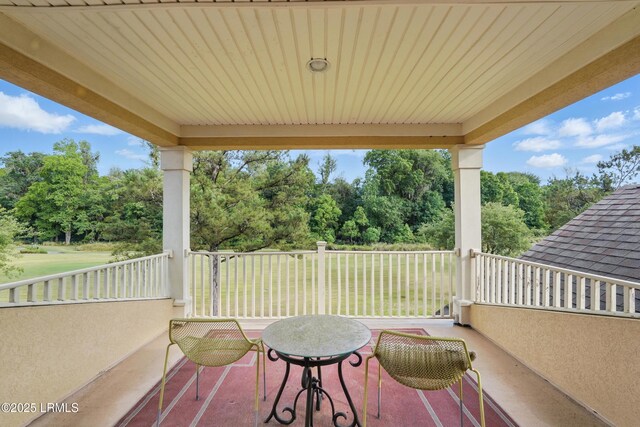 27 Normandy Ave, Bluffton, SC 29910 - view of patio with view of wooded area and a balcony