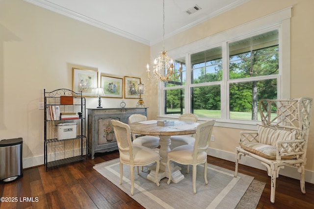 27 Normandy Ave, Bluffton, SC 29910 - dining room with crown molding, a chandelier, dark wood-style floors, and baseboards