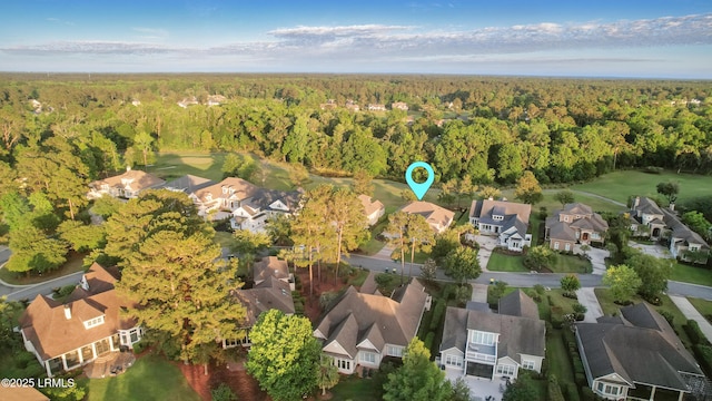 27 Normandy Ave, Bluffton, SC 29910 - aerial view of property and surrounding area with a heavily wooded area and nearby suburban area