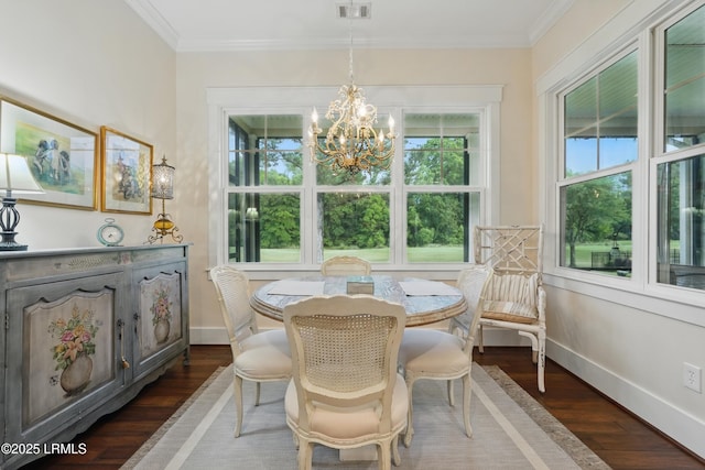 27 Normandy Ave, Bluffton, SC 29910 - dining space featuring dark wood finished floors, baseboards, a chandelier, and crown molding