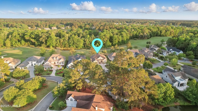 27 Normandy Ave, Bluffton, SC 29910 - aerial view of property's location with a heavily wooded area, a golf course, and nearby suburban area