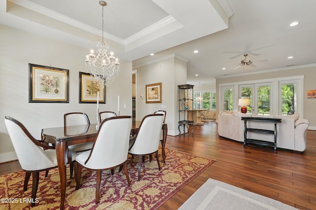 27 Normandy Ave, Bluffton, SC 29910 - dining area with dark wood finished floors, a chandelier, crown molding, recessed lighting, and baseboards