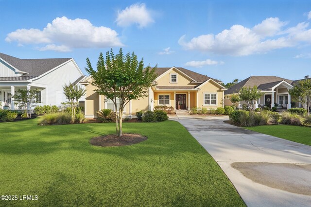 27 Normandy Ave, Bluffton, SC 29910 - view of front of house featuring stucco siding, driveway, and a front yard