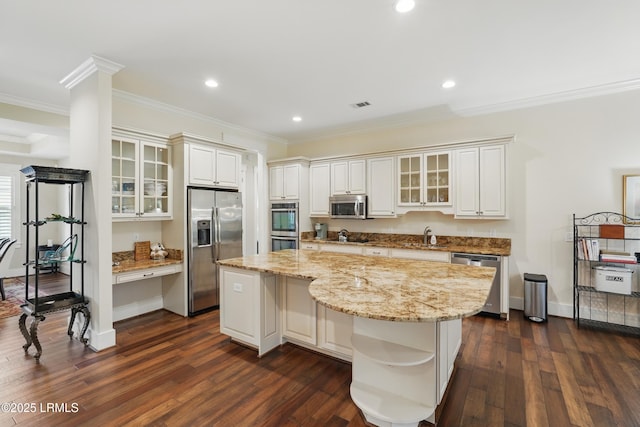 27 Normandy Ave, Bluffton, SC 29910 - kitchen featuring appliances with stainless steel finishes, crown molding, a center island, dark wood-type flooring, and recessed lighting