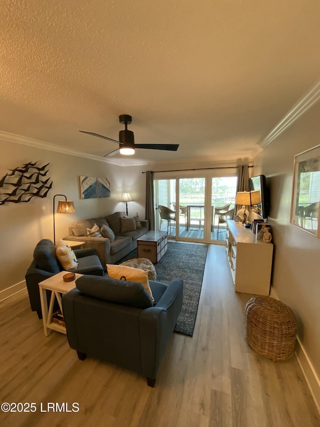 171 Beach Club Villa Dr Unit 171, Fripp Island, SC 29920 - living room with wood finished floors, crown molding, a ceiling fan, and a textured ceiling