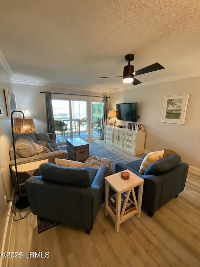 171 Beach Club Villa Dr Unit 171, Fripp Island, SC 29920 - living area with light wood-style floors, ornamental molding, a textured ceiling, and ceiling fan