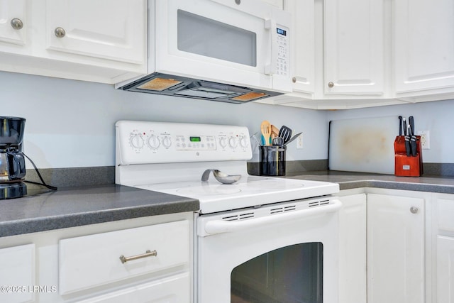 1980 Abbey Glen Way Unit 1980, Hardeeville, SC 29927 - kitchen featuring white cabinets, dark countertops, and white appliances