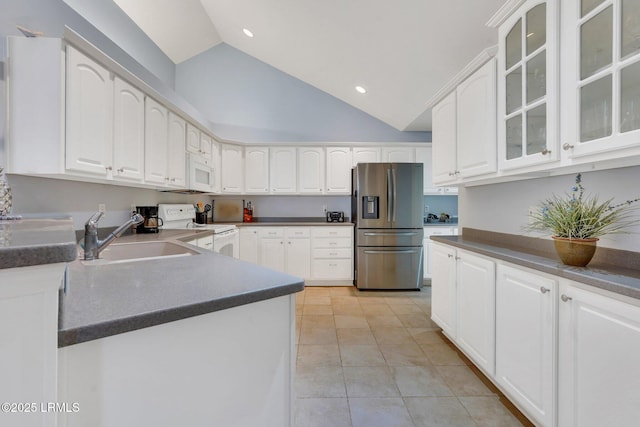 1980 Abbey Glen Way Unit 1980, Hardeeville, SC 29927 - kitchen with light tile patterned floors, white appliances, dark countertops, and a sink