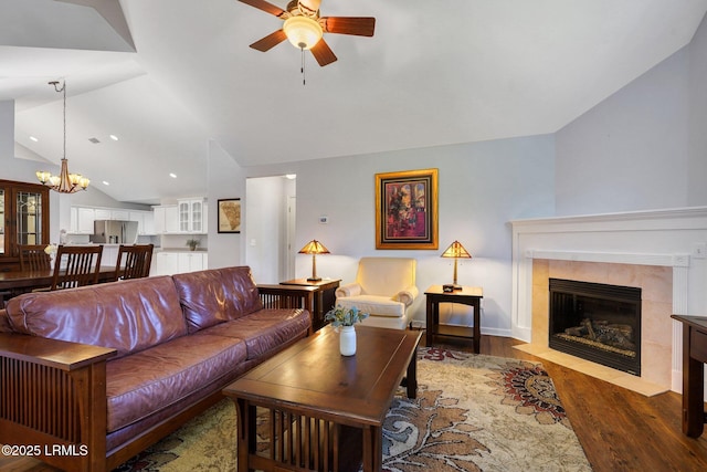 1980 Abbey Glen Way Unit 1980, Hardeeville, SC 29927 - living room featuring a tile fireplace, wood finished floors, ceiling fan with notable chandelier, vaulted ceiling, and recessed lighting
