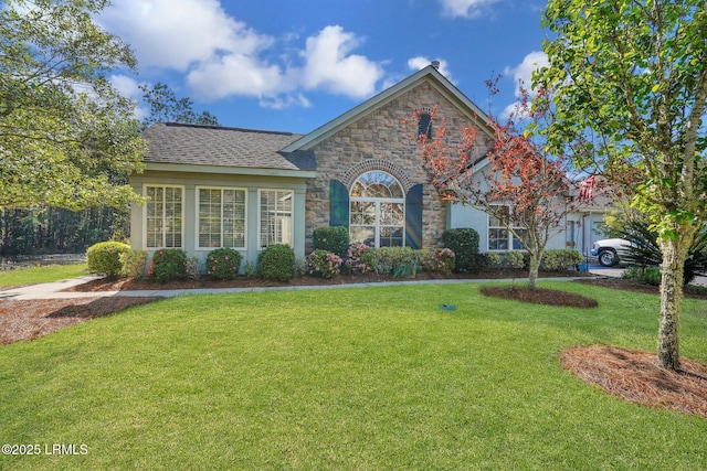 1980 Abbey Glen Way Unit 1980, Hardeeville, SC 29927 - view of front of home with stone siding and a front lawn