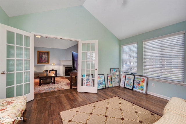 1980 Abbey Glen Way Unit 1980, Hardeeville, SC 29927 - interior space featuring baseboards, a fireplace, high vaulted ceiling, and wood finished floors