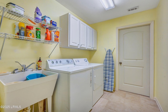 1980 Abbey Glen Way Unit 1980, Hardeeville, SC 29927 - laundry area featuring washing machine and dryer, a sink, cabinet space, visible vents, and baseboards