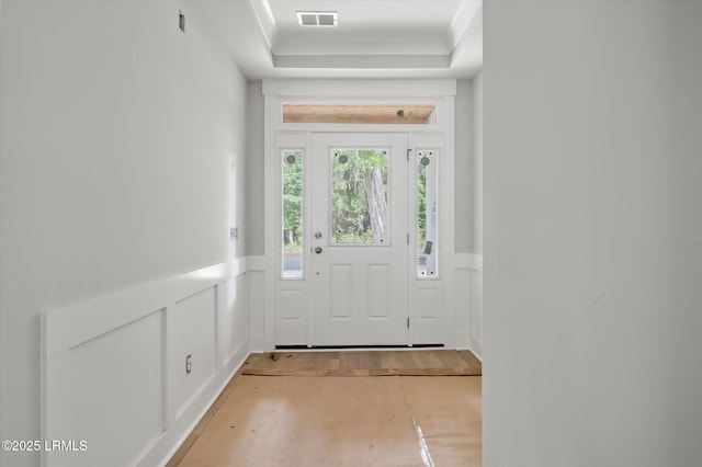 1 Alumni Rd, Beaufort, SC 29907 - entryway featuring a wainscoted wall, a decorative wall, light wood finished floors, and visible vents